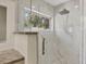 Modern shower with glass door and tile surround at 3931 Bay Shore Rd, Sarasota, FL 34234