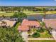 Stunning single-story home boasts water and golf course views with a screened-in lanai at 407 Fieldstone Dr, Venice, FL 34292