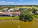 Aerial view of a house highlighting the backyard pool and water view, encircled for emphasis at 407 Fieldstone Dr, Venice, FL 34292