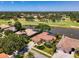 Stunning single-story home boasts water and golf course views with mature landscaping at 407 Fieldstone Dr, Venice, FL 34292