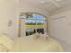 Bedroom featuring a serene view of a lake and golf course, enhancing relaxation at 407 Fieldstone Dr, Venice, FL 34292
