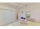 Bright bedroom with a large closet and view of the golf course at 407 Fieldstone Dr, Venice, FL 34292