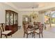 Dining area with a chandelier and china cabinet at 407 Fieldstone Dr, Venice, FL 34292