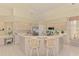 Modern kitchen with sleek appliances, a breakfast bar, and ample cabinet space at 407 Fieldstone Dr, Venice, FL 34292