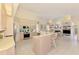 Bright kitchen with stainless steel appliances, a breakfast bar, and open access to living area at 407 Fieldstone Dr, Venice, FL 34292
