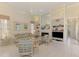 Cozy living room with built-in shelving, fireplace, and comfortable seating at 407 Fieldstone Dr, Venice, FL 34292