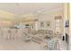 Bright and airy living space with an open-concept design and comfortable furnishings at 407 Fieldstone Dr, Venice, FL 34292