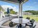 Attractive outdoor patio area with comfortable seating, ideal for relaxing and enjoying the pleasant weather and scenic views at 407 Fieldstone Dr, Venice, FL 34292