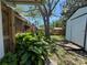 Private backyard featuring storage shed and lush landscaping at 4170 Prudence Dr, Sarasota, FL 34235