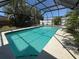 Screened-in pool with sunny views and palm tree landscaping at 4170 Prudence Dr, Sarasota, FL 34235