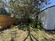 Exterior shot of storage shed with lush landscaping in yard at 4170 Prudence Dr, Sarasota, FL 34235