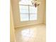 Inviting dining area featuring tile floors, natural light through large window, and blank walls ready for decor at 4456 Callaway St, Port Charlotte, FL 33981