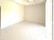 An empty room with tile floors, blank walls, and a ceiling fan, perfect for creating a personalized space at 4456 Callaway St, Port Charlotte, FL 33981