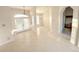 Bright open-plan living area with tile flooring, lots of natural light, and neutral walls ready for personalized decor at 4456 Callaway St, Port Charlotte, FL 33981