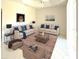 Inviting living room featuring neutral-toned furnishings, a decorative rug, and ample seating for relaxation and entertainment at 4456 Callaway St, Port Charlotte, FL 33981