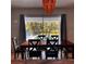 Dining room with view to the pool and manicured back yard at 4576 Cooper Rd, Sarasota, FL 34232