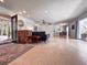 Open floor plan featuring a spacious living room, dining area, and views to the outdoor garden at 4576 Cooper Rd, Sarasota, FL 34232