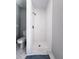 Modern bathroom featuring a glass enclosed shower with white subway tile and marble accents at 4576 Cooper Rd, Sarasota, FL 34232