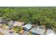 Aerial view showcases a well-maintained neighborhood, mature trees, and several quaint single-story homes at 4741 Watkins Ave, Sarasota, FL 34233