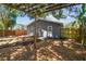 Backyard with a pergola and a charming cottage, perfect for outdoor relaxation at 4741 Watkins Ave, Sarasota, FL 34233