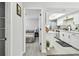 Open layout from a bedroom into the kitchen, showing the property's great accessibility and modern design at 4741 Watkins Ave, Sarasota, FL 34233