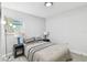 Cozy bedroom with natural light, featuring a queen-size bed and modern lamps at 4741 Watkins Ave, Sarasota, FL 34233