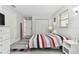 Relaxing bedroom with a view from the window with neutral walls and wood look flooring at 4741 Watkins Ave, Sarasota, FL 34233