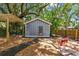 Charming cottage with a private backyard, featuring a pergola and seating area at 4741 Watkins Ave, Sarasota, FL 34233
