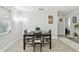 The dining area features a view into another room, a table set for four, and decor at 4741 Watkins Ave, Sarasota, FL 34233