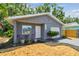 Charming single-story home with a freshly painted exterior and a well-maintained front yard, perfect for curb appeal at 4741 Watkins Ave, Sarasota, FL 34233