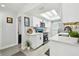 Modern kitchen featuring white cabinets, quartz countertops, and stainless steel appliances, designed for culinary enthusiasts at 4741 Watkins Ave, Sarasota, FL 34233
