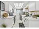 Modern kitchen with white cabinets, subway tile backsplash, stainless appliances and plenty of counter space at 4741 Watkins Ave, Sarasota, FL 34233