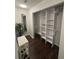 Walk-in closet with custom shelving and a full-length mirror at 4907 Kilty E Ct, Bradenton, FL 34203