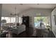 Bright and airy living room and dining room boast an open floor plan and offer views of the sparkling pool at 4907 Kilty E Ct, Bradenton, FL 34203