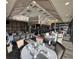 Elegant restaurant area with tables set for dining in a well-lit setting at 4907 Kilty E Ct, Bradenton, FL 34203
