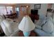 Cozy living room with couches, a coffee table, and easy access to dining area at 4920 Boca Raton Ave, Sarasota, FL 34234