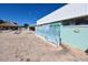 Fun dolphin mural on the restroom building by the pool deck and tiki hut at 4920 Boca Raton Ave, Sarasota, FL 34234