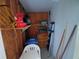 Storage room with shelving, a ladder, and various household supplies at 4920 Boca Raton Ave, Sarasota, FL 34234