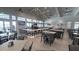The modern bar area is spacious and well-lit, with multiple TVs and ample seating for patrons at 4970 Oyster Pearl St, Lakewood Ranch, FL 34211