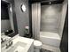 Stylish bathroom with patterned wallpaper, tub/shower, modern fixtures, and vanity at 4970 Oyster Pearl St, Lakewood Ranch, FL 34211