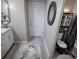 Powder room with modern fixtures, blue vanity details, and unique decorations at 4970 Oyster Pearl St, Lakewood Ranch, FL 34211