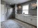 Bathroom with large glass enclosed shower, double vanity, and modern grey tile at 4970 Oyster Pearl St, Lakewood Ranch, FL 34211