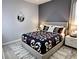 Bedroom featuring gray walls, modern bed frame, and neutral decor at 4970 Oyster Pearl St, Lakewood Ranch, FL 34211