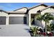 Attractive home exterior with a two-car garage, well-manicured landscaping, and a welcoming entrance at 4970 Oyster Pearl St, Lakewood Ranch, FL 34211