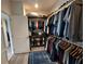 Organized walk-in closet with ample storage space, featuring rods for hanging clothes and shelves for folded items at 4970 Oyster Pearl St, Lakewood Ranch, FL 34211