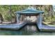 Covered boathouse for easy water access and boat storage, perfect for waterfront living and boating enthusiasts at 5033 Oxford Dr, Sarasota, FL 34242