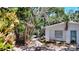 Charming exterior view of a single Gathering home with a front yard and walkway at 5033 Oxford Dr, Sarasota, FL 34242