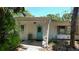 Exterior view of a home's front porch and light blue front door at 5033 Oxford Dr, Sarasota, FL 34242