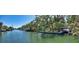 Picturesque waterfront scene featuring mature trees, docks, boats, and scenic water views for tranquil living at 5033 Oxford Dr, Sarasota, FL 34242