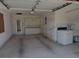 Spacious garage offers ample storage space with built-in cabinets, utility sink and plenty of room for parking at 5315 Malamin Rd, North Port, FL 34287